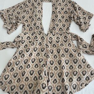 Shorts romper with daring deep v neckline and back. Size M, Oliviaceous